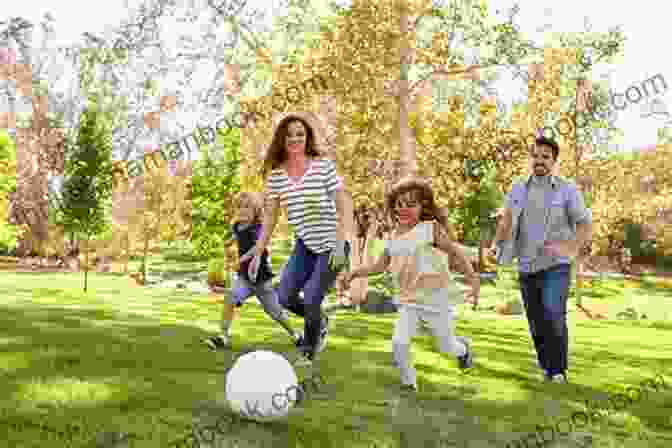 A Happy Family Playing Together In A Park. Children Of Tomorrow: Guidelines For Raising Happy Children In The 21st Century